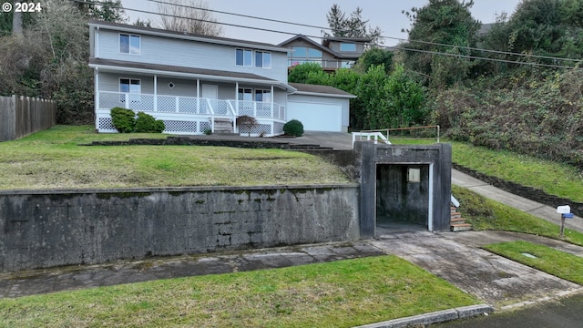 view of front of house with covered porch and a front yard