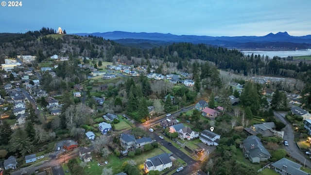 bird's eye view with a water and mountain view