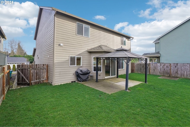 back of house with a yard, a gazebo, and a patio