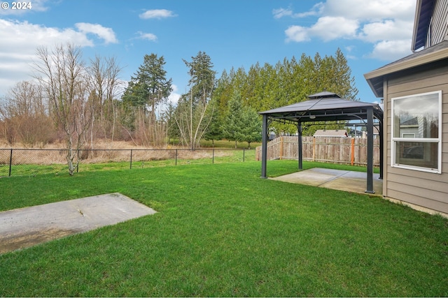 view of yard featuring a gazebo and a patio area