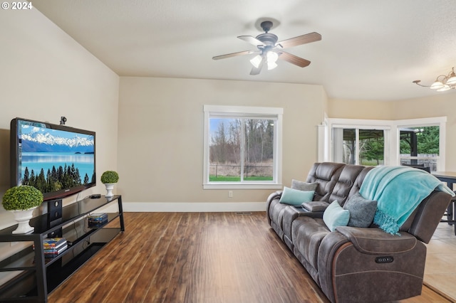 living room with ceiling fan and hardwood / wood-style floors