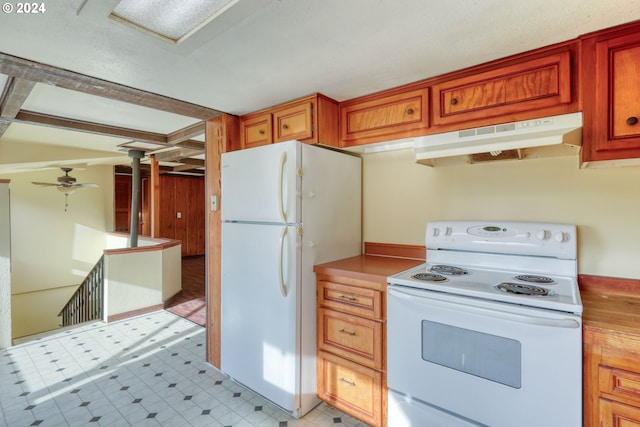 kitchen with white appliances and ceiling fan