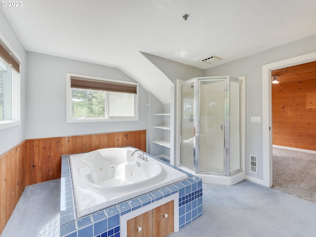 bathroom featuring lofted ceiling, built in shelves, plus walk in shower, and wood walls