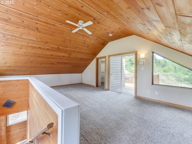 bonus room with lofted ceiling, a wealth of natural light, wood ceiling, and carpet floors