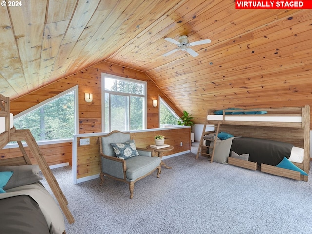 bedroom featuring multiple windows, vaulted ceiling, wooden walls, and wood ceiling