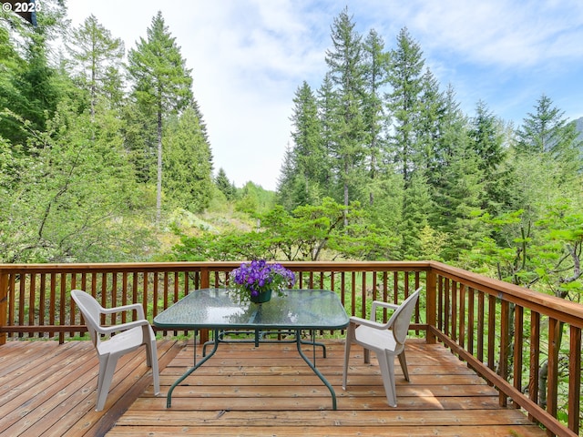 deck featuring outdoor dining area