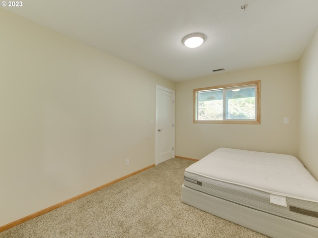 bedroom featuring visible vents, baseboards, and carpet floors