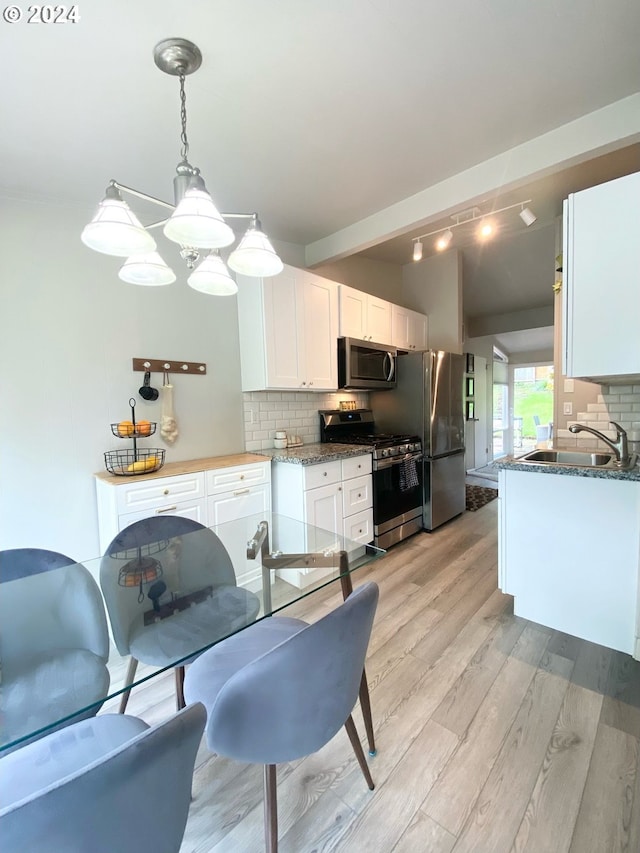 dining area featuring light wood-style floors