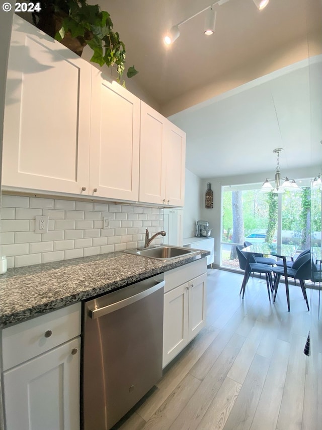 kitchen featuring vaulted ceiling with beams, a sink, white cabinetry, decorative backsplash, and dishwasher