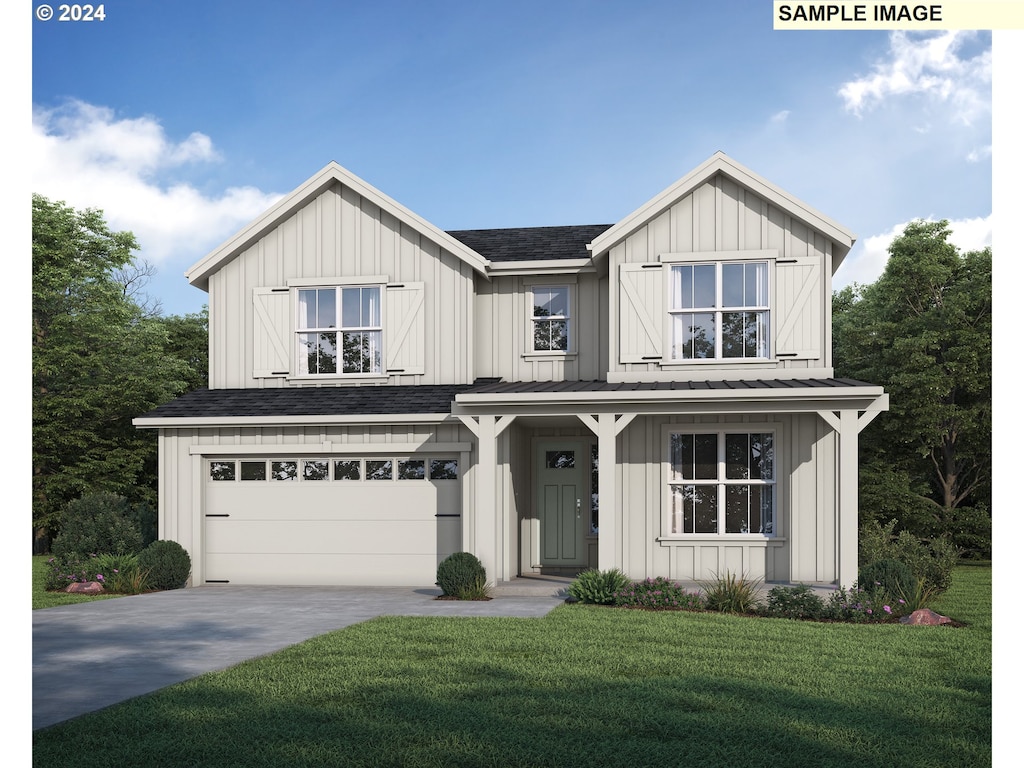 view of front of home featuring a garage and a front yard