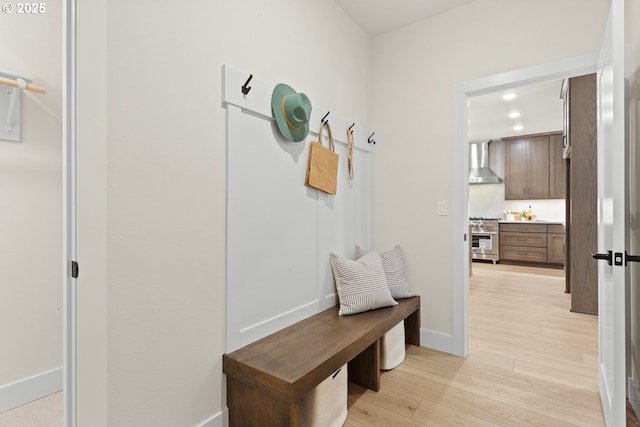 mudroom featuring light wood-type flooring, baseboards, and recessed lighting