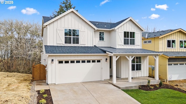 modern farmhouse featuring driveway, board and batten siding, an attached garage, a standing seam roof, and a shingled roof