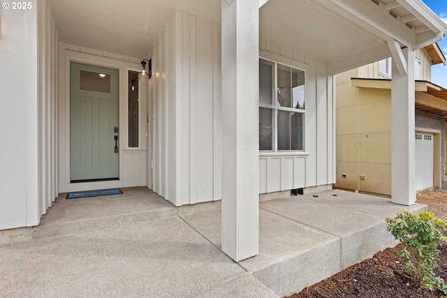 doorway to property featuring board and batten siding