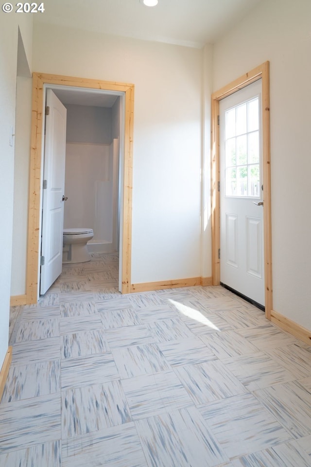 interior space featuring baseboards