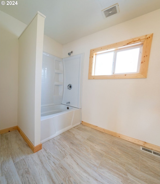 full bathroom featuring shower / tub combination, visible vents, and baseboards