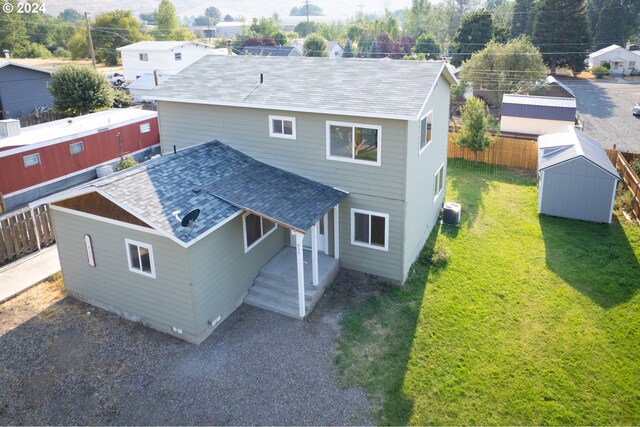 exterior space with a yard and a storage shed