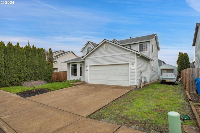 view of front property with a garage and a front lawn