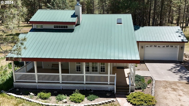 view of front of house featuring a porch and a garage