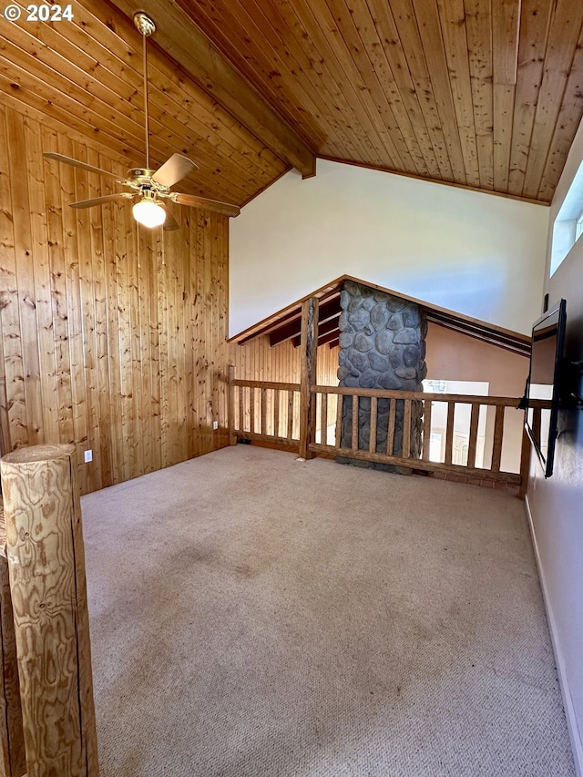 bonus room with lofted ceiling with beams, ceiling fan, carpet floors, and wooden ceiling