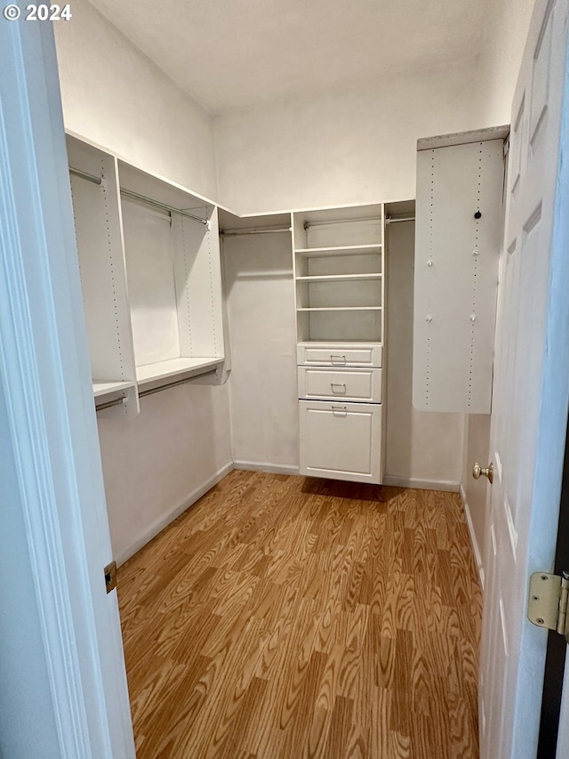 walk in closet featuring light wood-type flooring