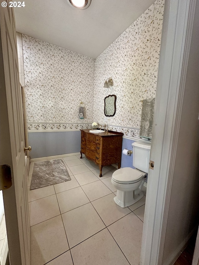 bathroom featuring tile patterned floors, vanity, and toilet