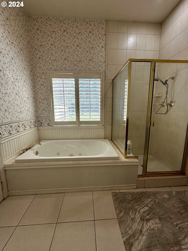 bathroom featuring tile patterned floors and shower with separate bathtub