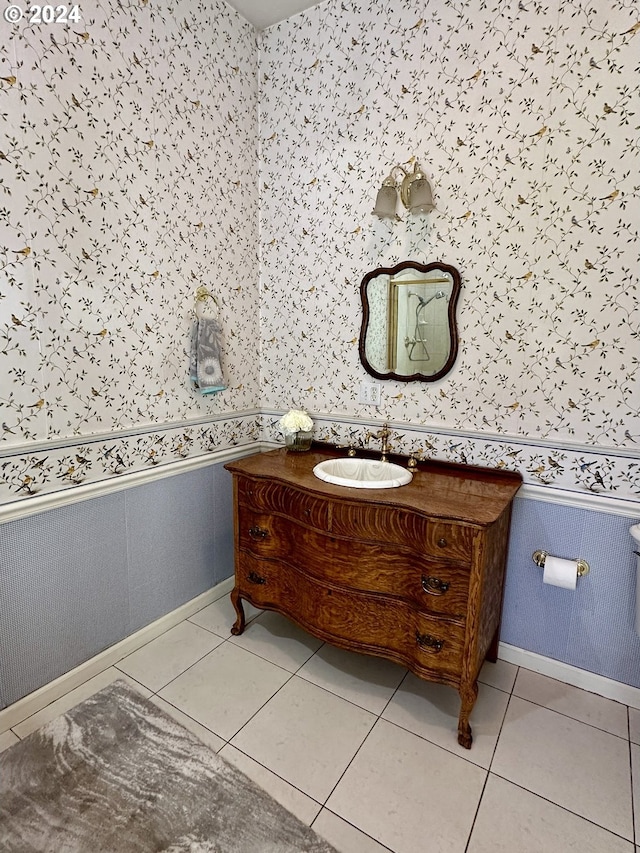 bathroom with tile patterned floors and vanity