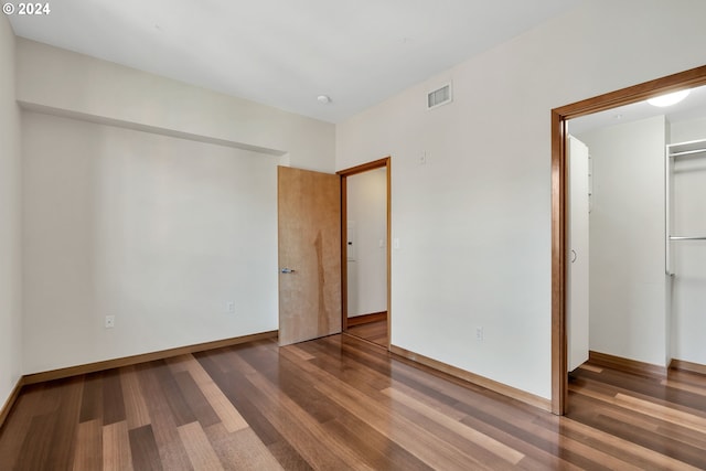 unfurnished bedroom featuring hardwood / wood-style floors