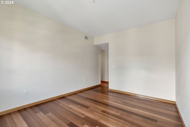 spare room with hardwood / wood-style floors