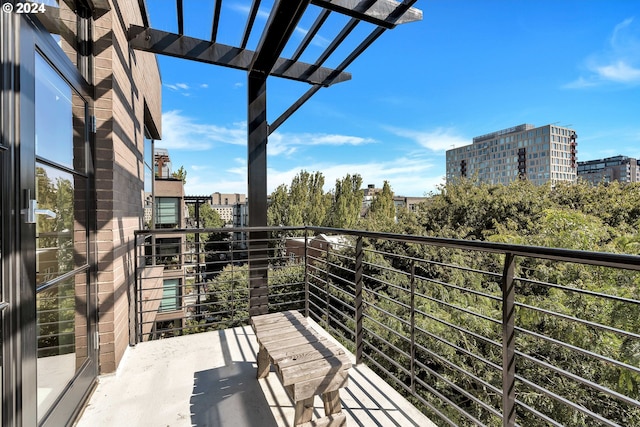 balcony featuring a pergola