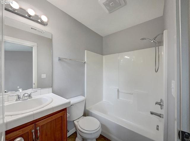 full bathroom featuring toilet, vanity, and shower / bathtub combination