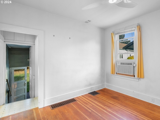 empty room with hardwood / wood-style floors