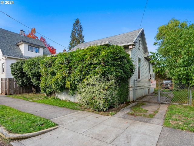 view of side of home featuring cooling unit