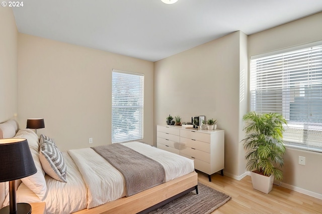 bedroom featuring light wood-type flooring