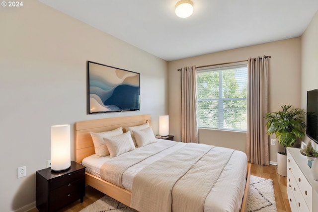 bedroom with light hardwood / wood-style flooring