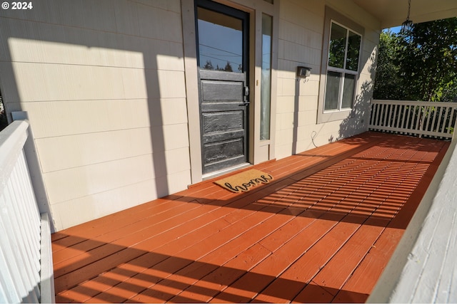 wooden terrace featuring covered porch