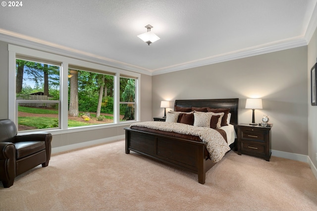 carpeted bedroom featuring crown molding