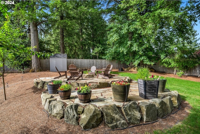 view of yard with a patio area and an outdoor fire pit