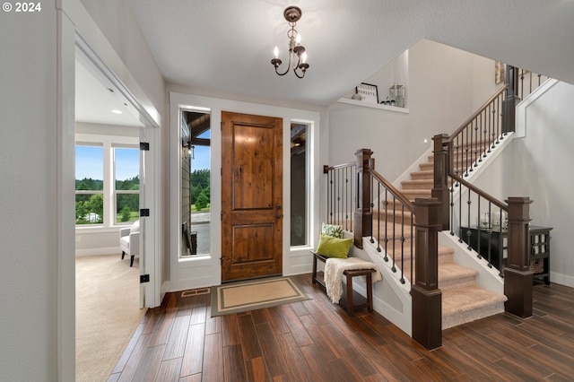 entrance foyer featuring a notable chandelier