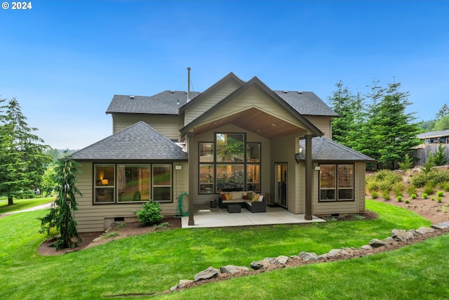 rear view of house featuring a lawn, a patio area, and an outdoor hangout area