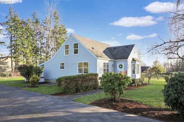 view of front of home with a front yard