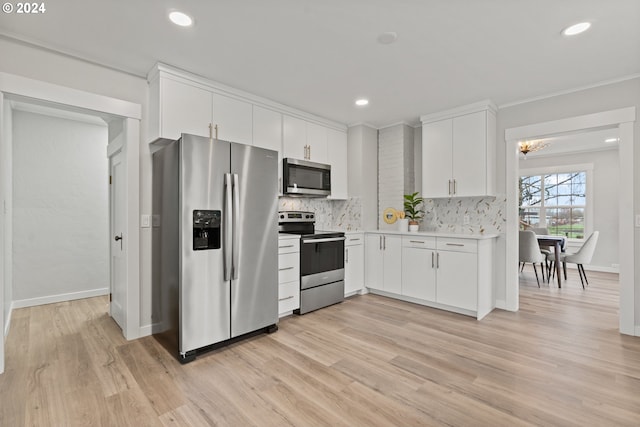 kitchen featuring light hardwood / wood-style floors, white cabinetry, and stainless steel appliances