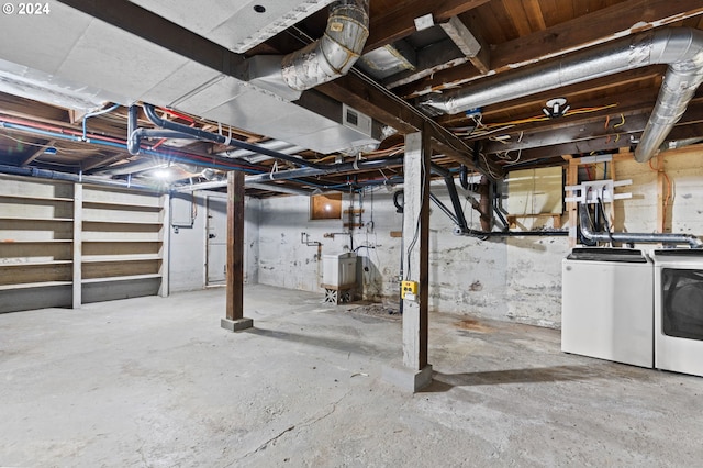 basement with washer and clothes dryer