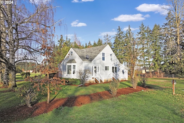 view of front of home featuring a front yard