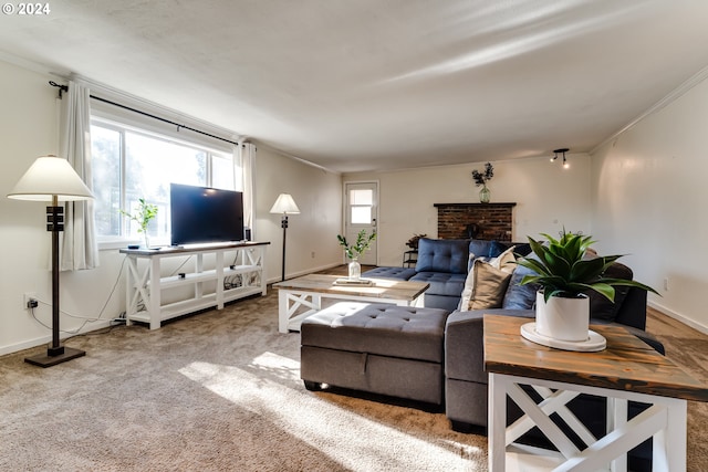 carpeted living room with ornamental molding and a brick fireplace