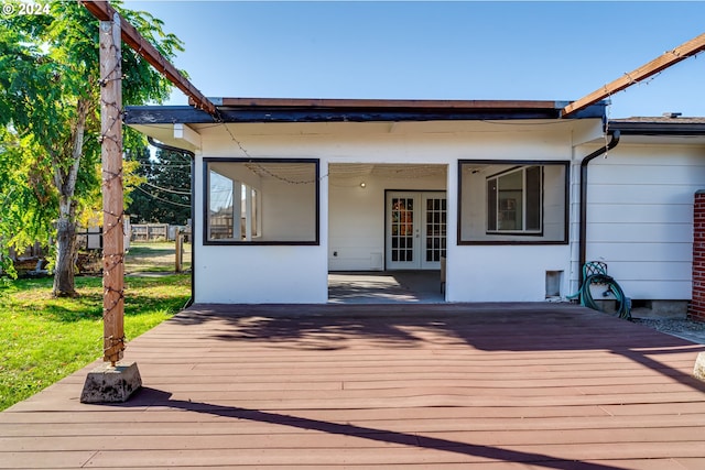 wooden deck featuring french doors