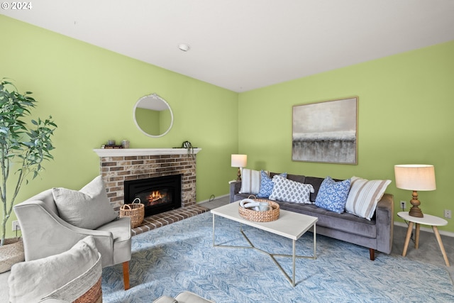 living room with a brick fireplace