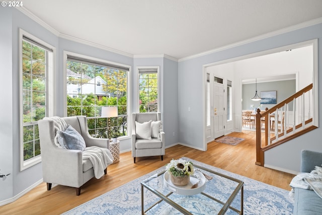 living room featuring crown molding and hardwood / wood-style floors