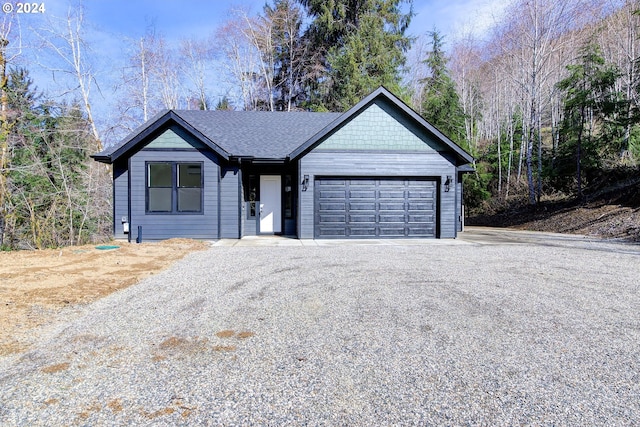 ranch-style home featuring a garage