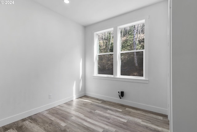 unfurnished room with light hardwood / wood-style flooring